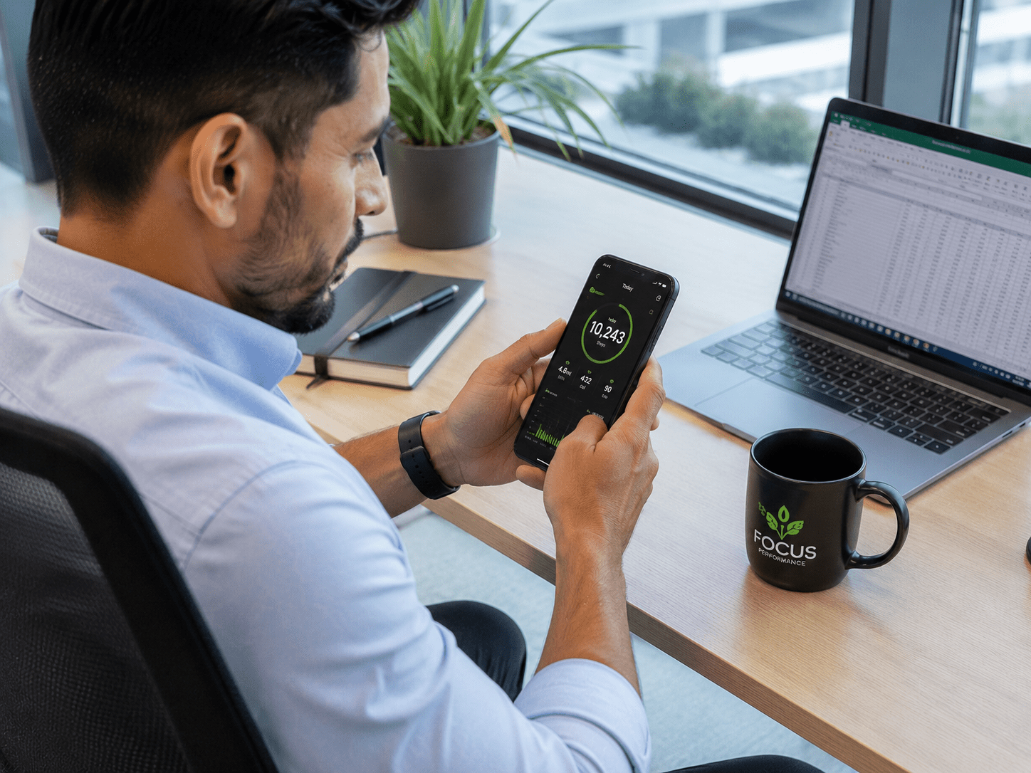 Office worker using a mobile fitness app to track daily activity and exercise goals