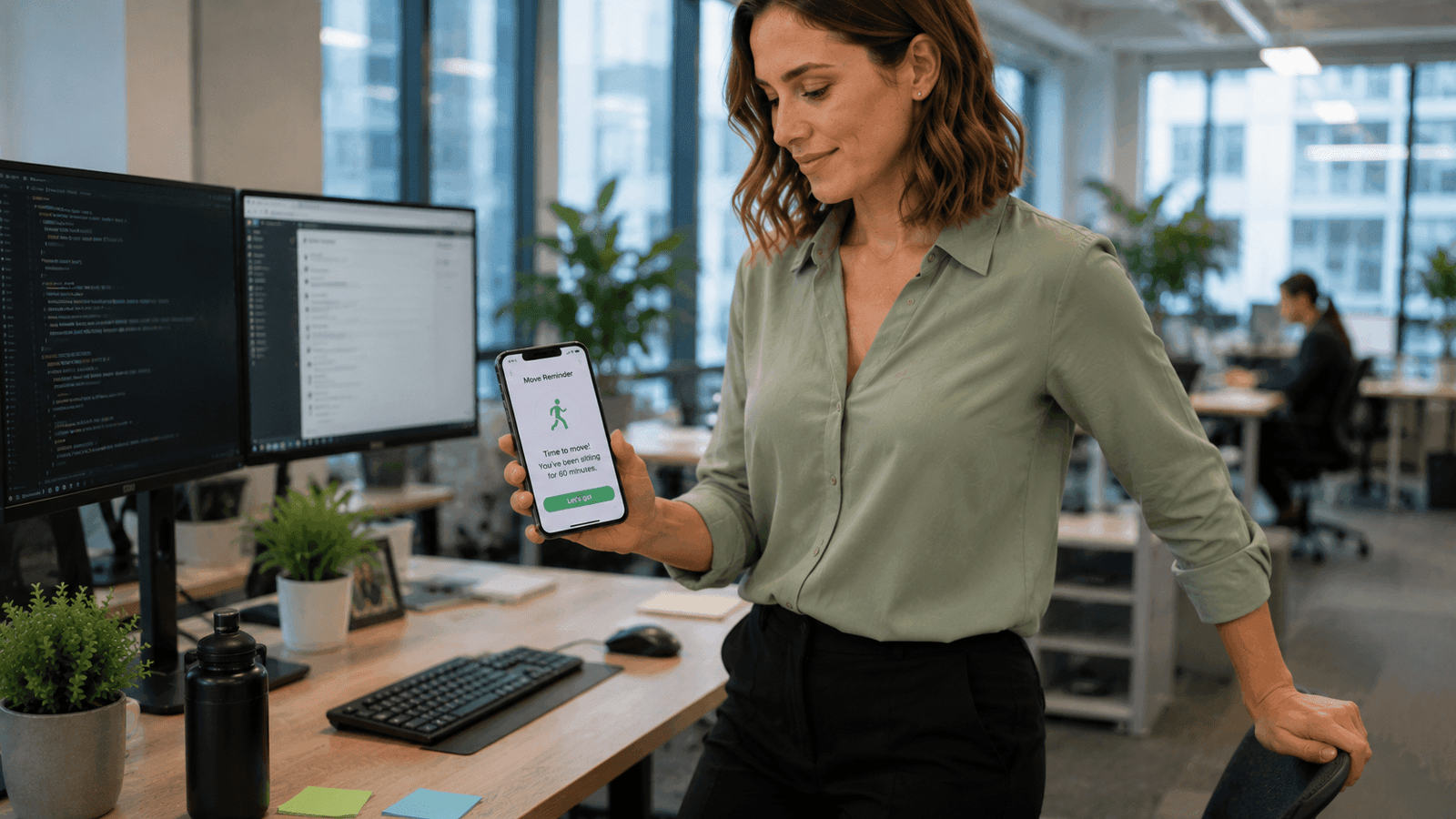 Office employee receiving a movement reminder notification from a mobile fitness app